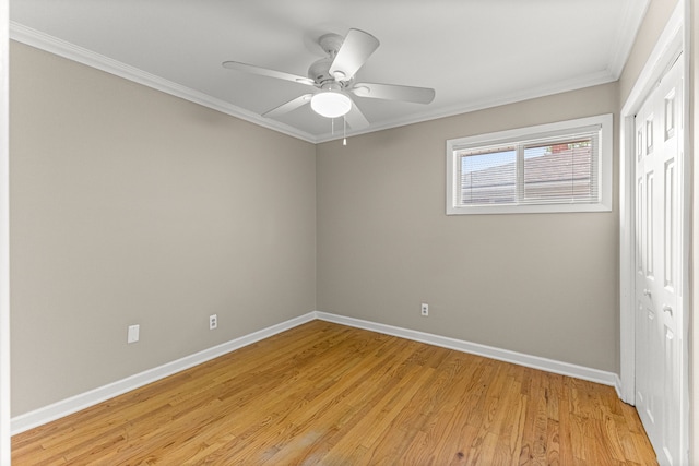 4938 Lincoln Blvd, Dearborn Heights, MI 48125 - unfurnished bedroom with a closet, baseboards, crown molding, light wood finished floors, and a ceiling fan