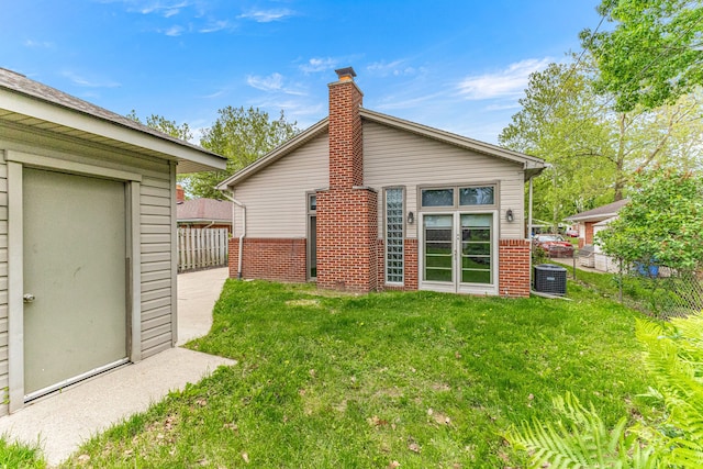 4938 Lincoln Blvd, Dearborn Heights, MI 48125 - rear view of house featuring cooling unit and brick siding