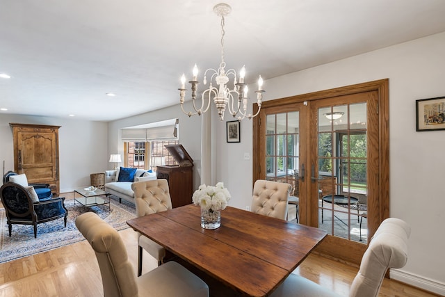dining area with french doors, a notable chandelier, light wood-type flooring, baseboards, and recessed lighting