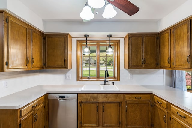 kitchen with light countertops, stainless steel dishwasher, brown cabinets, and a sink