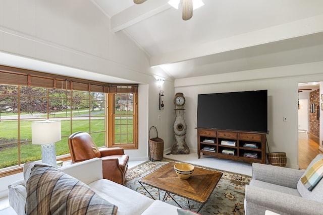 living room with ceiling fan, carpet, and lofted ceiling with beams