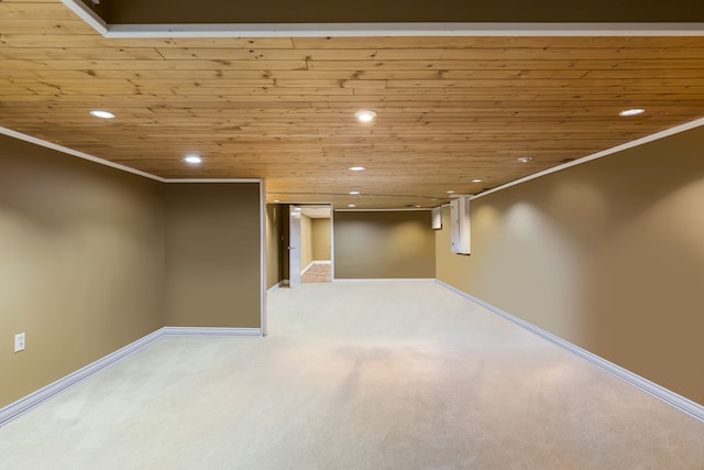 finished basement featuring baseboards, wood ceiling, recessed lighting, and carpet