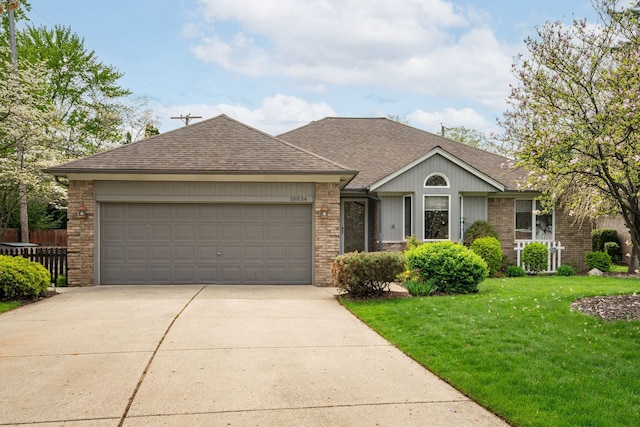 ranch-style house featuring fence, a shingled roof, brick siding, a garage, and driveway