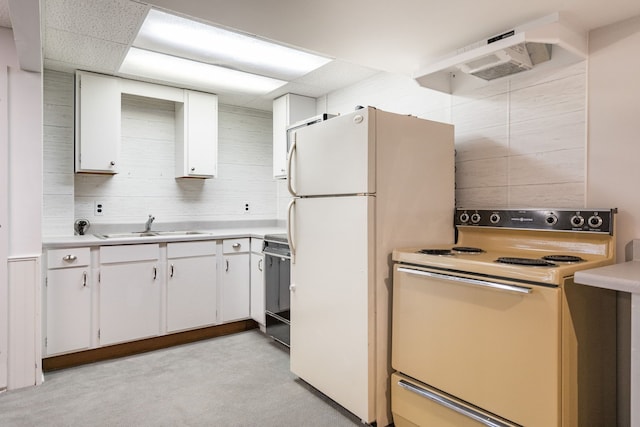 kitchen featuring a sink, white cabinetry, white appliances, and light countertops