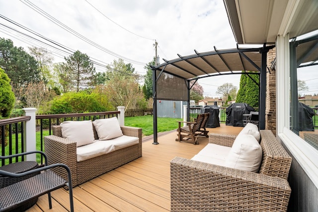 deck with grilling area, a lawn, a storage shed, an outbuilding, and an outdoor hangout area