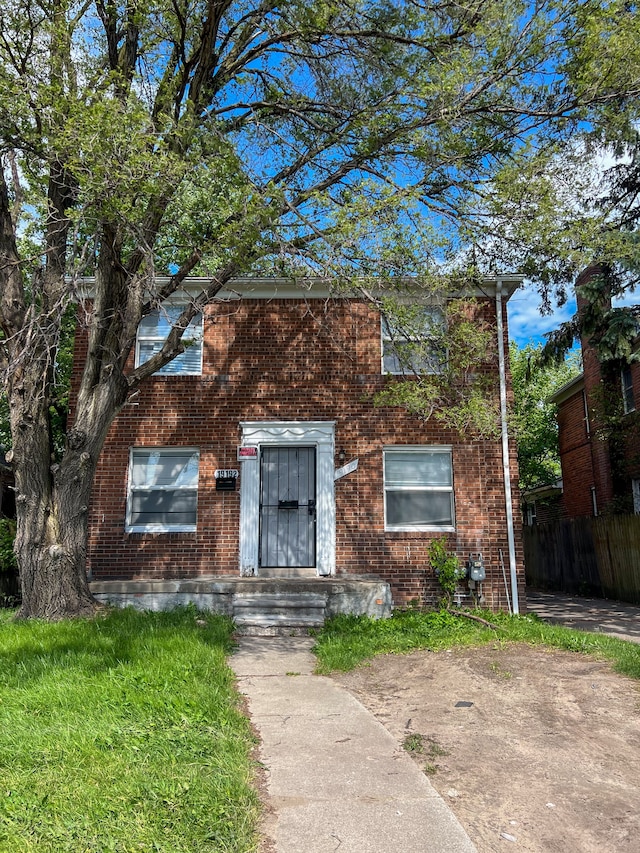 19190 Hoover St, Detroit, MI 48205 - view of front facade featuring brick siding and fence