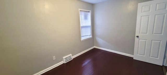 19190 Hoover St, Detroit, MI 48205 - spare room with baseboards and dark wood finished floors