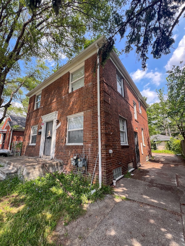 19190 Hoover St, Detroit, MI 48205 - view of front facade featuring brick siding and driveway