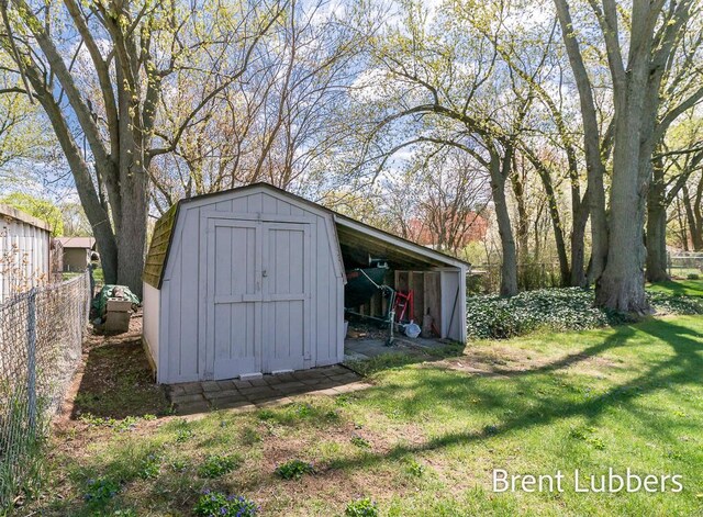 view of shed with fence