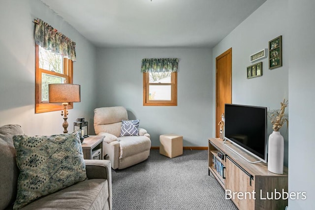 carpeted living room featuring baseboards