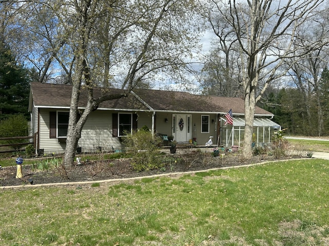 496 W Kenwood Rd, Twin Lake, MI 49457 - ranch-style house with a front lawn, roof with shingles, and fence