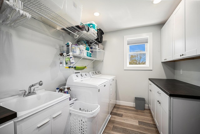 22873 Riverside Dr, Mendon, MI 49072 - clothes washing area with separate washer and dryer, dark wood-type flooring, cabinet space, baseboards, and recessed lighting