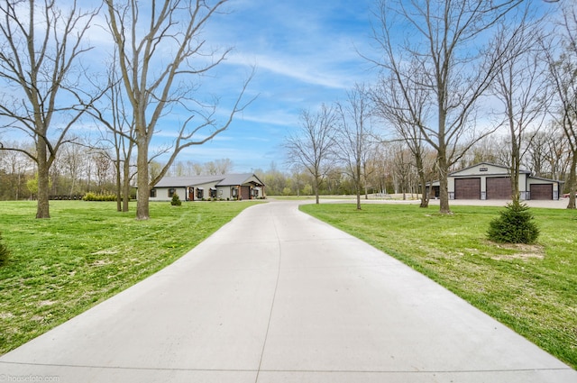 exterior space with concrete driveway