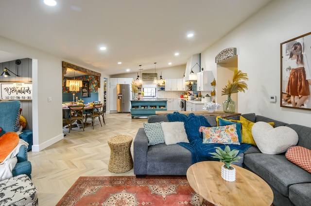 living room featuring baseboards and recessed lighting