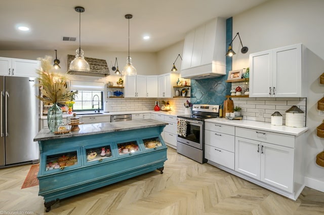 kitchen featuring custom exhaust hood, white cabinetry, open shelves, backsplash, and stainless steel appliances