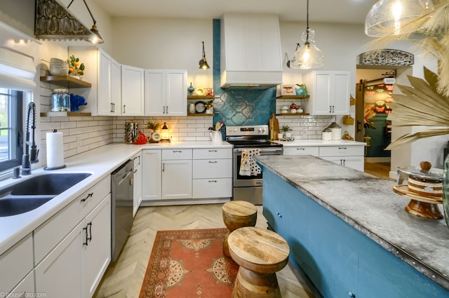 kitchen with a sink, open shelves, custom range hood, and appliances with stainless steel finishes