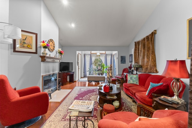 26901 Ann Arbor Trl, Dearborn Heights, MI 48127 - living room with a fireplace with flush hearth, wood finished floors, high vaulted ceiling, and recessed lighting