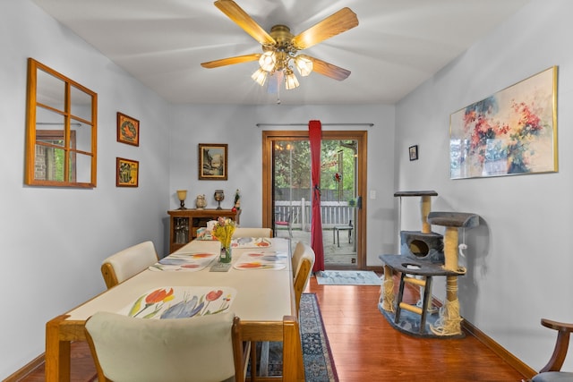 26901 Ann Arbor Trl, Dearborn Heights, MI 48127 - dining area with wood finished floors, a ceiling fan, and baseboards