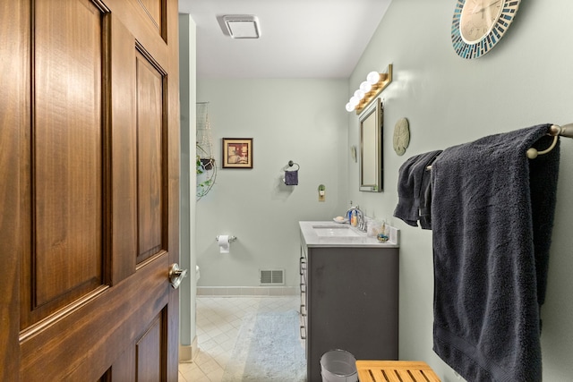 26901 Ann Arbor Trl, Dearborn Heights, MI 48127 - bathroom with tile patterned floors, vanity, and baseboards