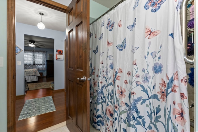 26901 Ann Arbor Trl, Dearborn Heights, MI 48127 - bathroom with wood finished floors, curtained shower, and ensuite bathroom