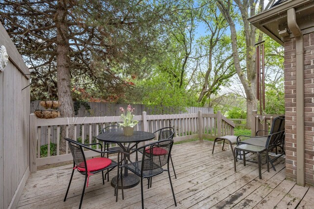 26901 Ann Arbor Trl, Dearborn Heights, MI 48127 - wooden deck featuring outdoor dining space and fence