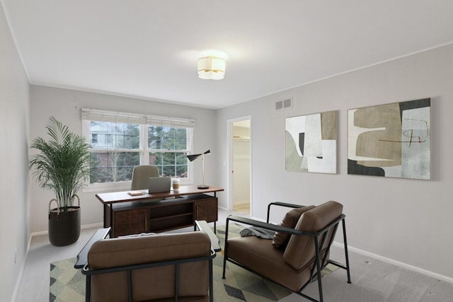 office area with baseboards, visible vents, and carpet