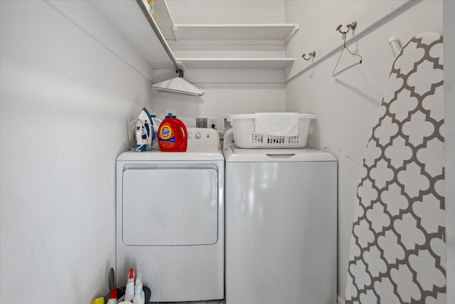 clothes washing area with laundry area and washing machine and clothes dryer