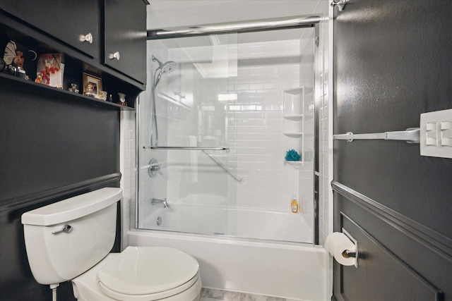 full bath featuring bath / shower combo with glass door and toilet