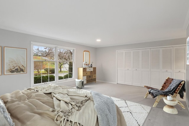 carpeted bedroom featuring crown molding, baseboards, a closet, and recessed lighting