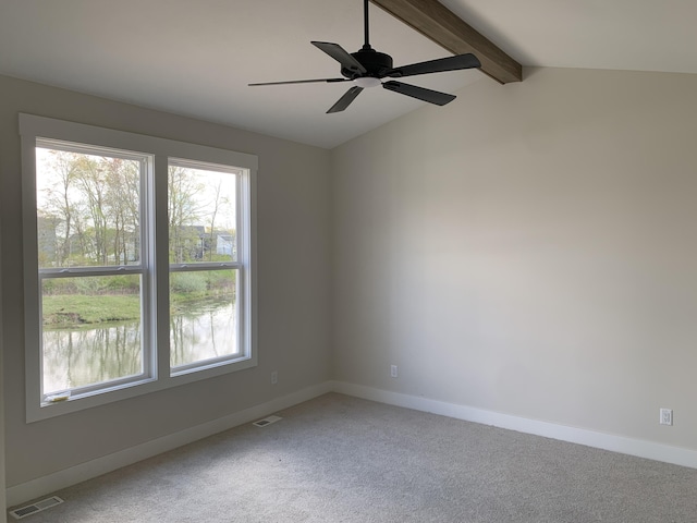 spare room with visible vents, light carpet, and a healthy amount of sunlight