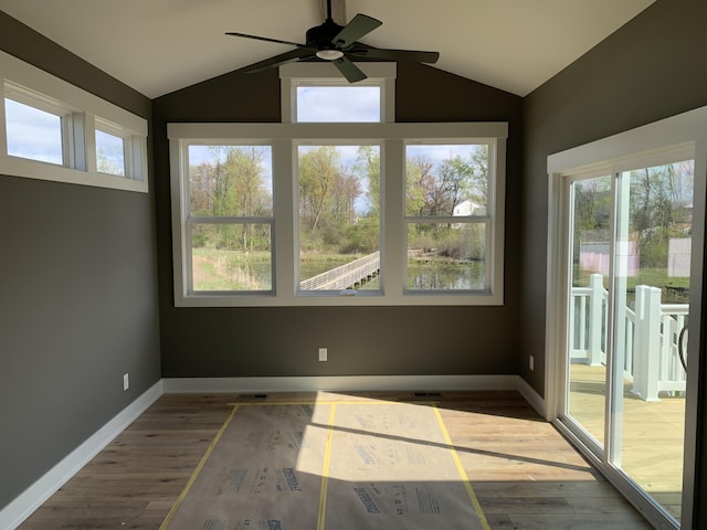 unfurnished sunroom with visible vents and a wealth of natural light