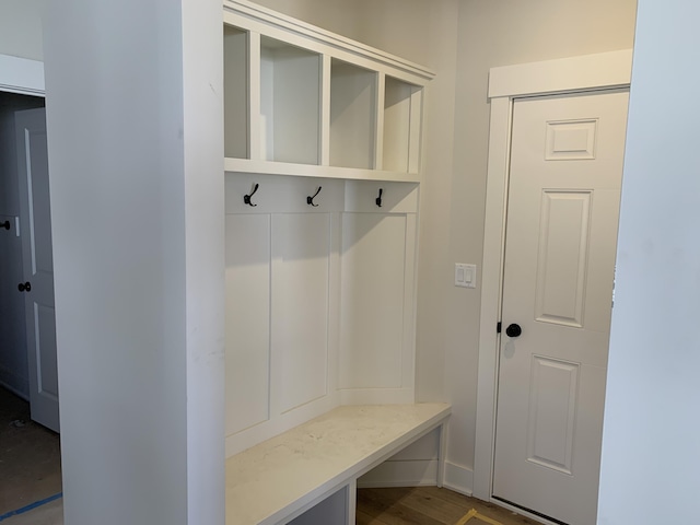 mudroom featuring baseboards and wood finished floors