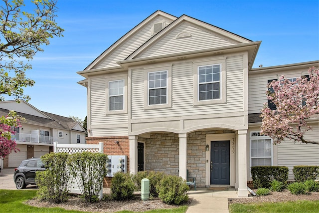 7200 Addington Dr, Commerce Twp, MI 48390 - view of front facade with stone siding and brick siding