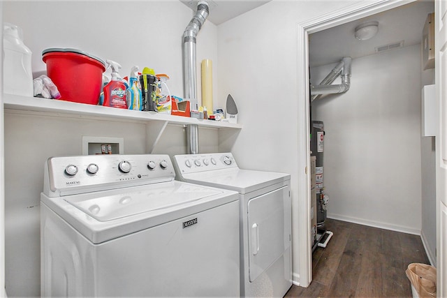 7200 Addington Dr, Commerce Twp, MI 48390 - washroom with washing machine and dryer, baseboards, visible vents, dark wood-type flooring, and laundry area