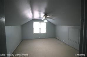 bonus room featuring carpet floors, ceiling fan, and lofted ceiling