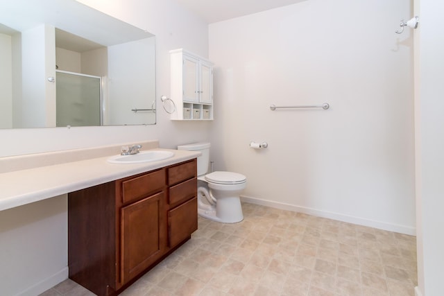 full bathroom with vanity, baseboards, toilet, and a shower stall