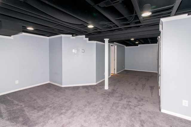 finished below grade area with baseboards and carpet