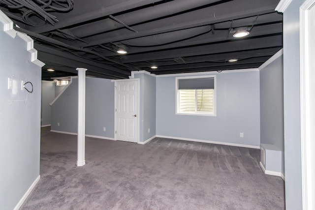 basement featuring carpet flooring and baseboards