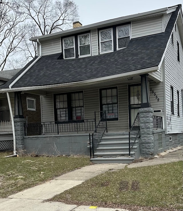 view of front facade featuring a porch, roof with shingles, and a chimney
