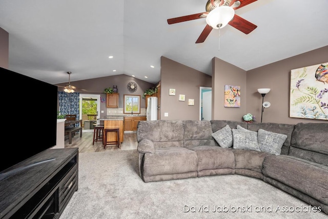 living area featuring ceiling fan, light wood-type flooring, recessed lighting, and lofted ceiling
