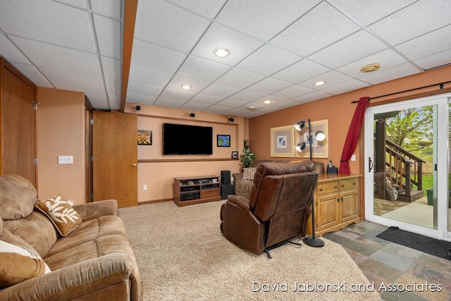 living area featuring recessed lighting and a drop ceiling