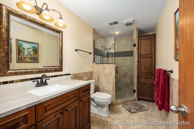 full bath with toilet, tile walls, visible vents, and a stall shower