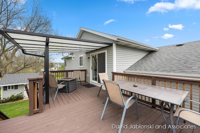 wooden deck with outdoor dining area