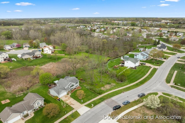 birds eye view of property with a residential view