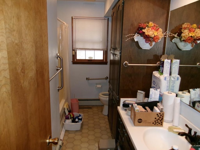 bathroom featuring vanity, toilet, a shower with shower curtain, and a baseboard radiator
