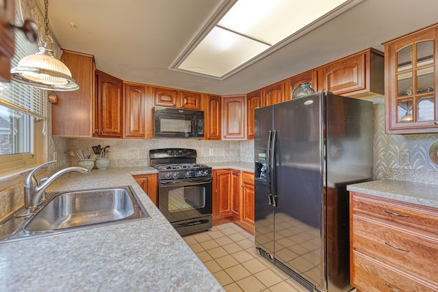 1471 Ledgewood Dr, Canton, MI 48188 - kitchen featuring black appliances, a sink, light tile patterned floors, light countertops, and backsplash