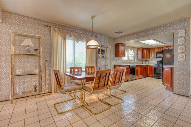 1471 Ledgewood Dr, Canton, MI 48188 - dining area with wallpapered walls and light tile patterned flooring