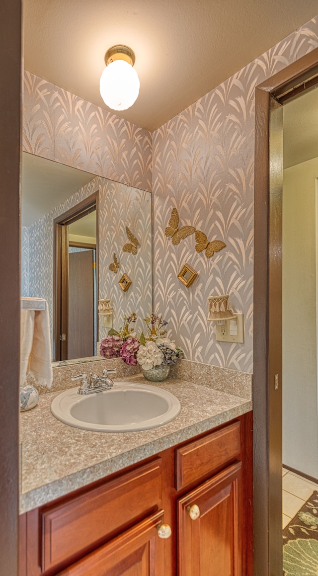 1471 Ledgewood Dr, Canton, MI 48188 - bathroom with wallpapered walls, vanity, and tile patterned flooring