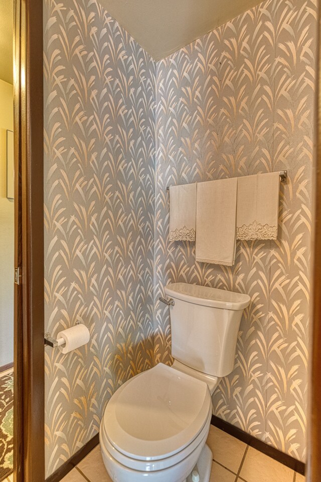1471 Ledgewood Dr, Canton, MI 48188 - bathroom featuring wallpapered walls, baseboards, toilet, and tile patterned floors