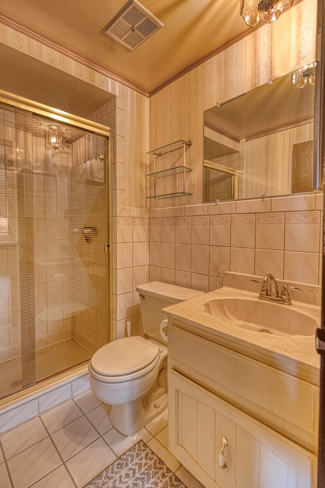 1471 Ledgewood Dr, Canton, MI 48188 - bathroom with tile walls, toilet, tile patterned flooring, a stall shower, and vanity